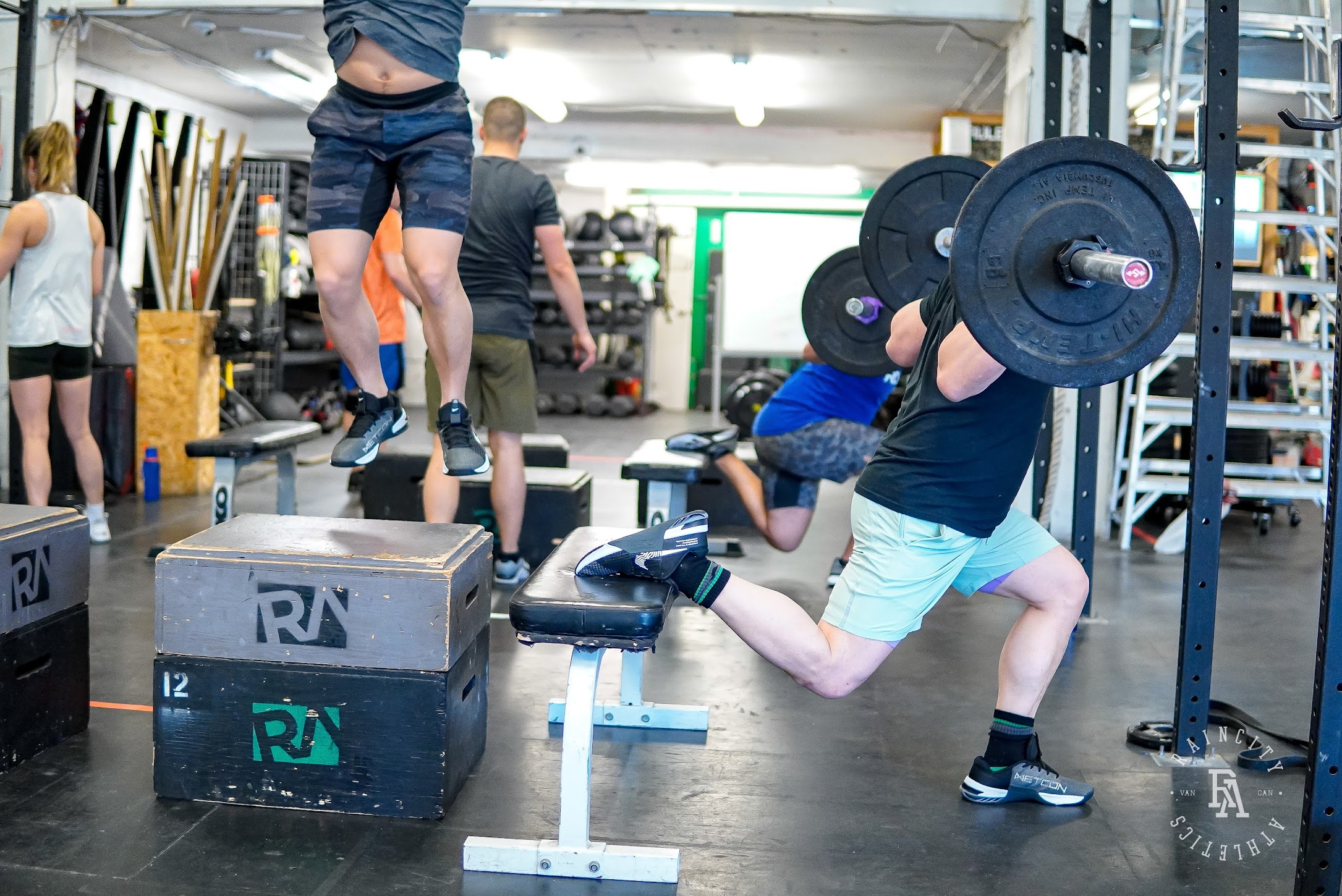 An athlete driving a push press out of the rack