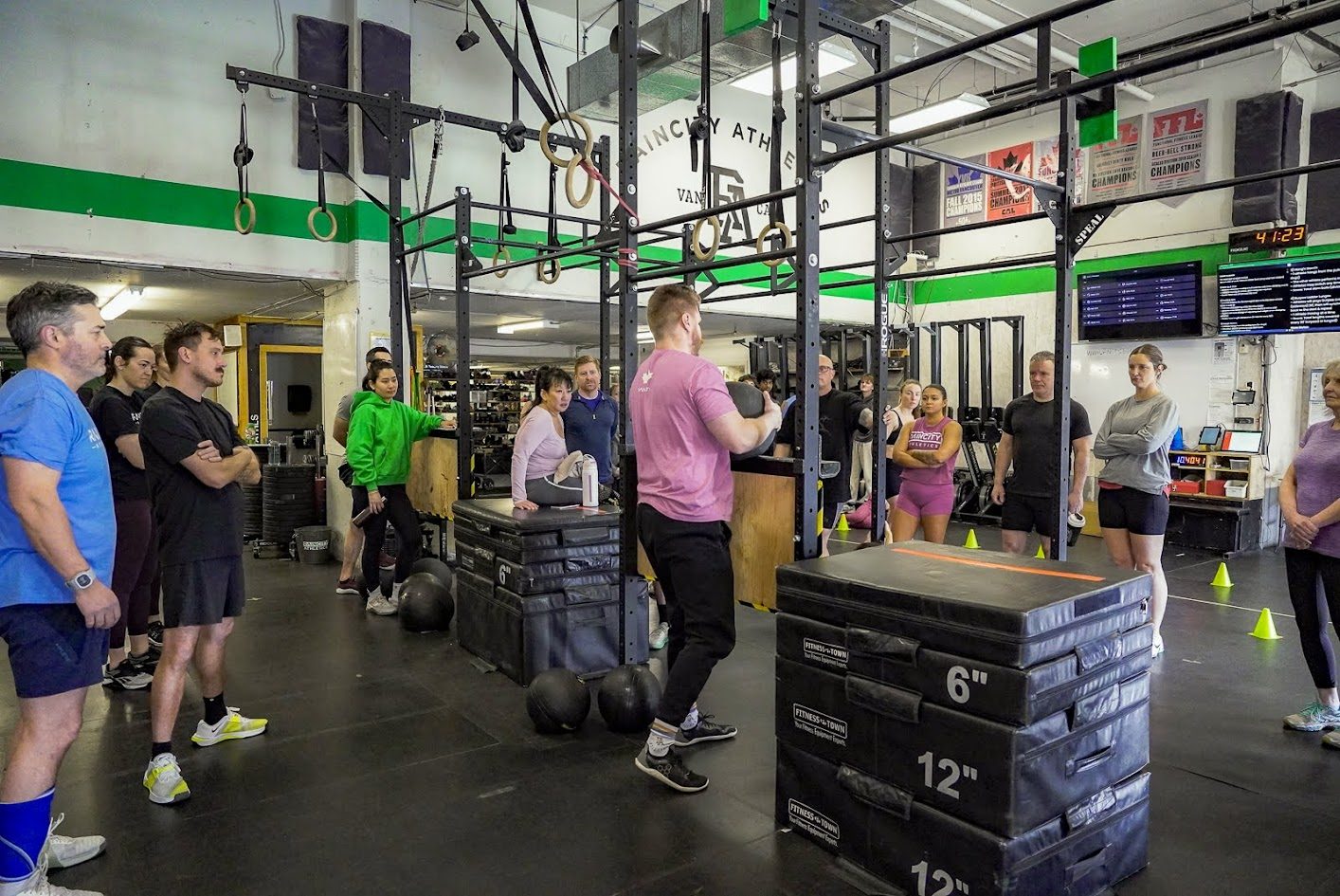 Athletes working through functional stations in class