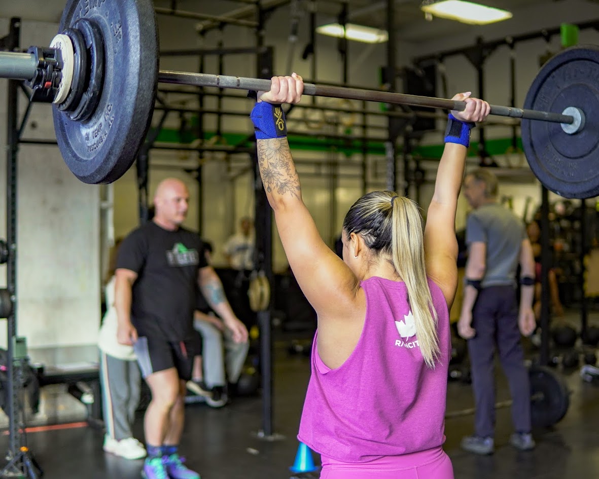 Athlete pressing a barbell overhead