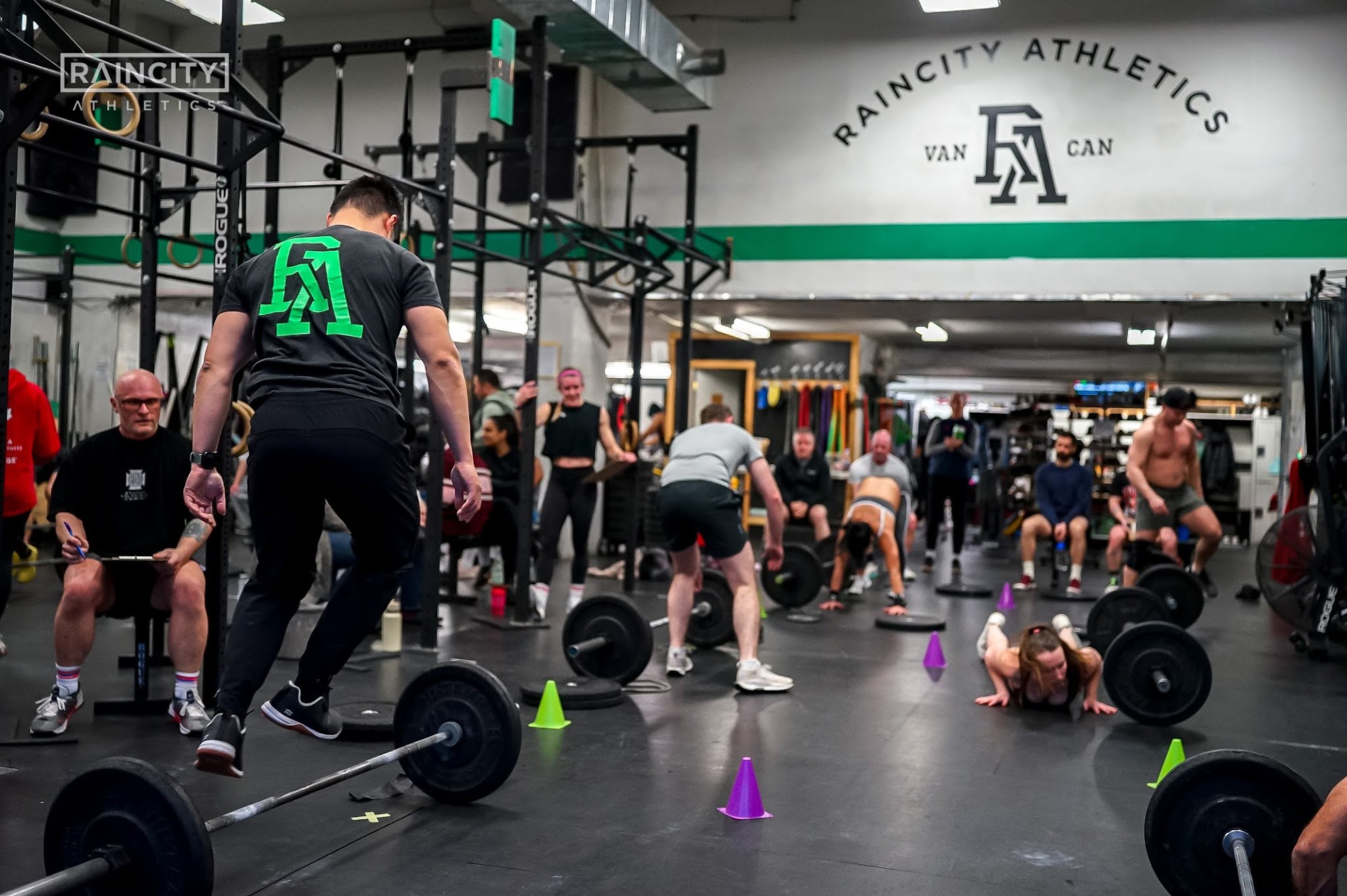 A full functional fitness class training together with barbells